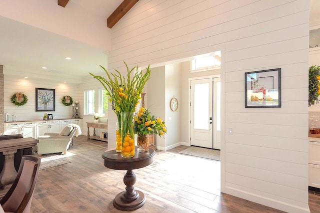 foyer with high vaulted ceiling, beamed ceiling, and hardwood / wood-style floors