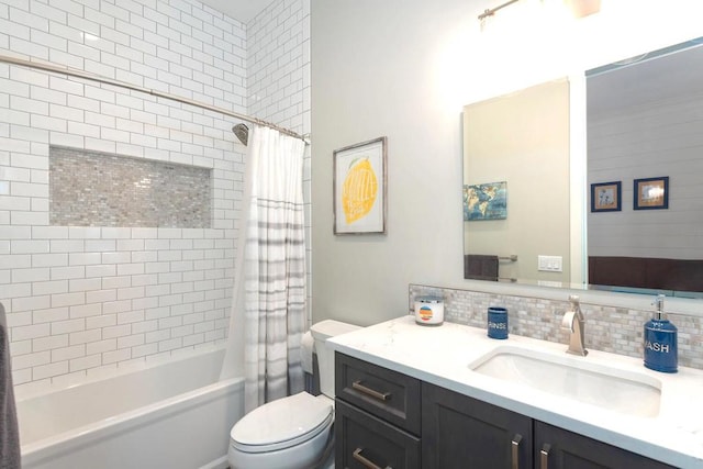 full bathroom with vanity, toilet, tasteful backsplash, and shower / tub combo with curtain