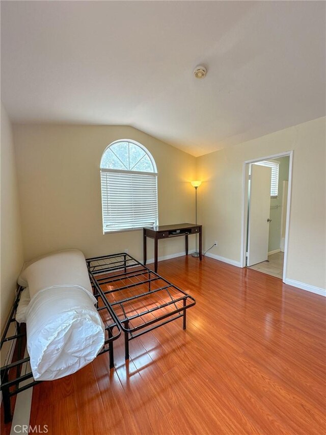 13168 Pinnacle Ct, Chino Hills, CA 91709 - sitting room with vaulted ceiling and wood finished floors