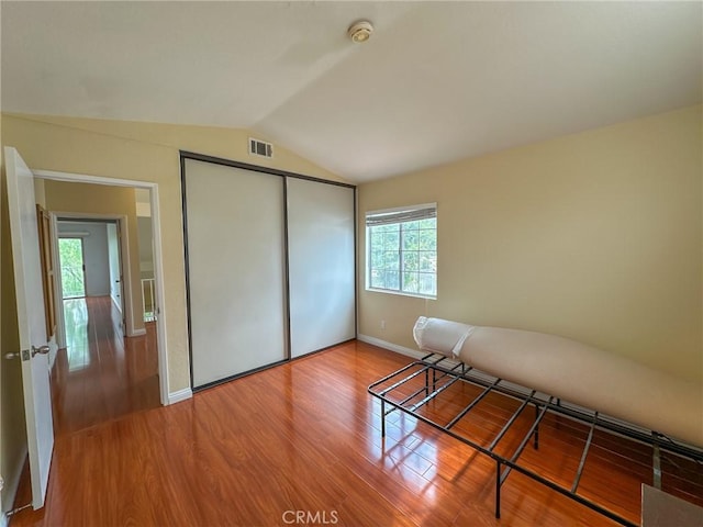13168 Pinnacle Ct, Chino Hills, CA 91709 - unfurnished bedroom with wood finished floors, lofted ceiling, and a closet