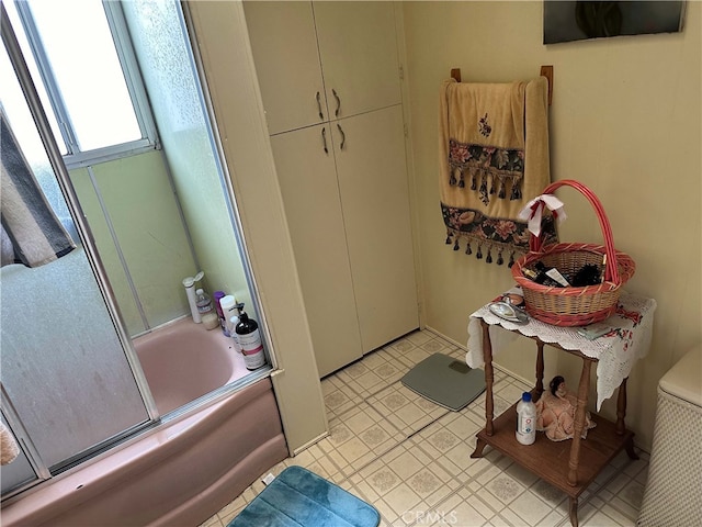 bathroom featuring enclosed tub / shower combo