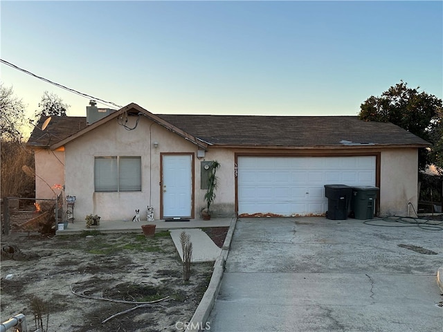 single story home featuring a garage