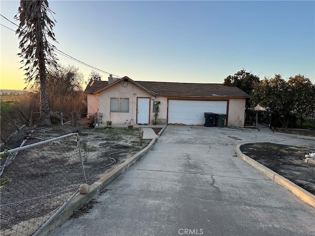 ranch-style house featuring a garage