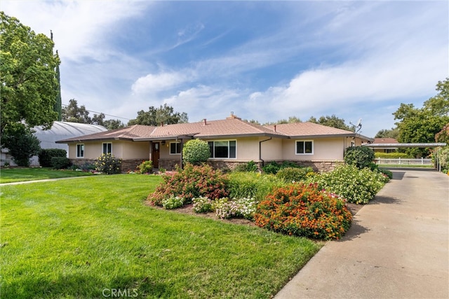 ranch-style house with a front lawn