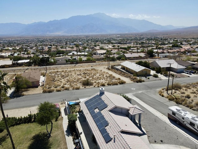 birds eye view of property with a mountain view