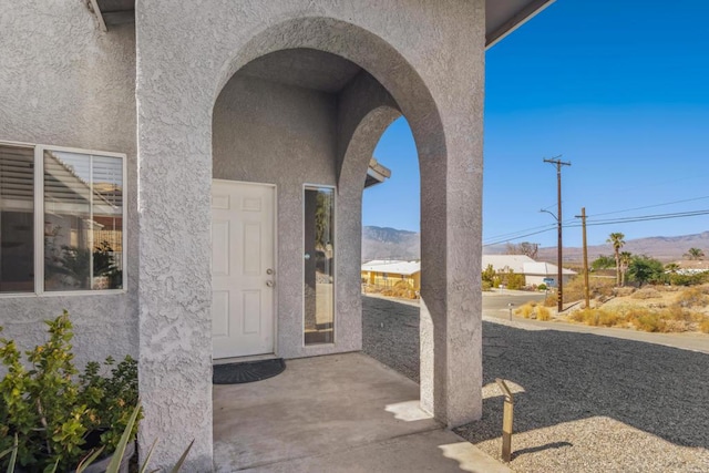 doorway to property with a mountain view