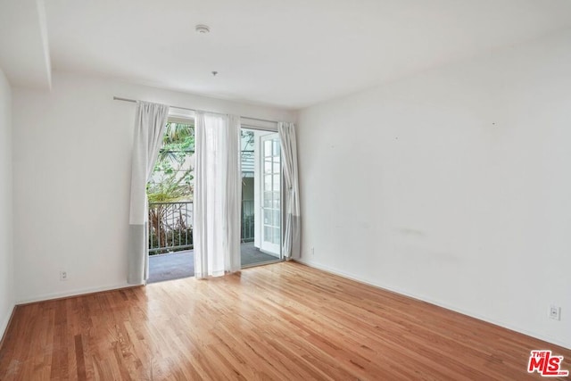 unfurnished room featuring light hardwood / wood-style flooring