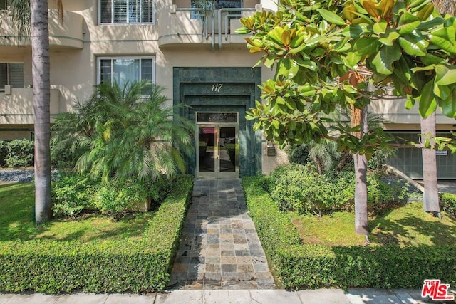 entrance to property featuring french doors