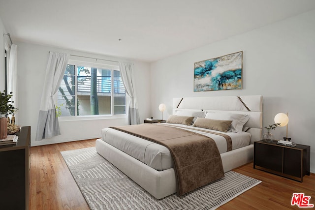 bedroom featuring wood-type flooring