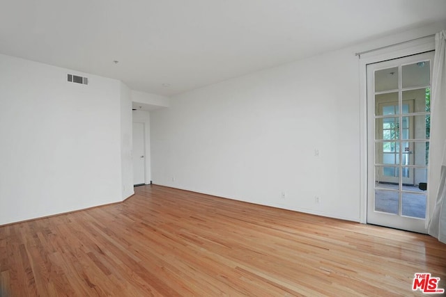 unfurnished room featuring light hardwood / wood-style flooring