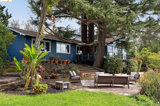 back of house with a patio area and an outdoor hangout area