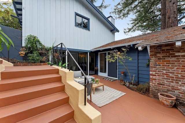 back of house with a patio