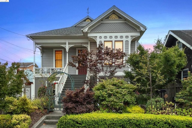 victorian house featuring covered porch