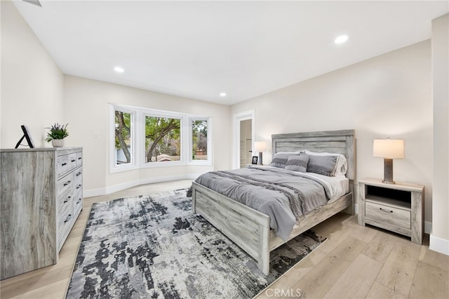 bedroom with light wood-type flooring