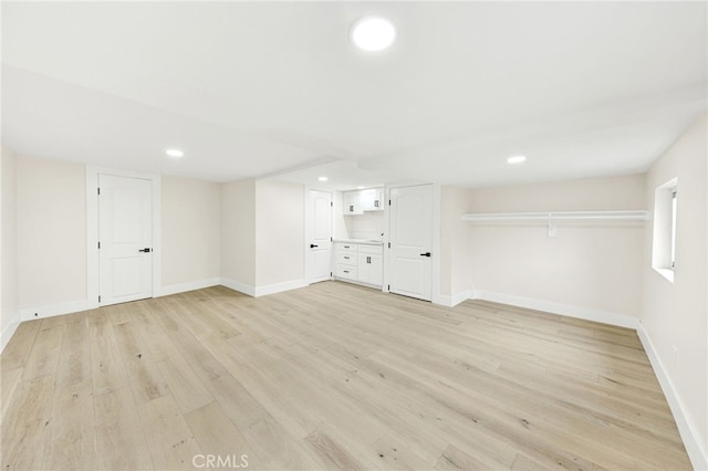 unfurnished living room with light hardwood / wood-style flooring