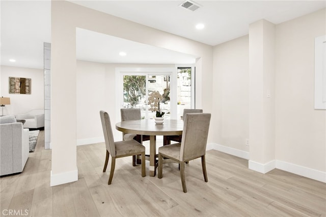 dining room featuring light hardwood / wood-style floors