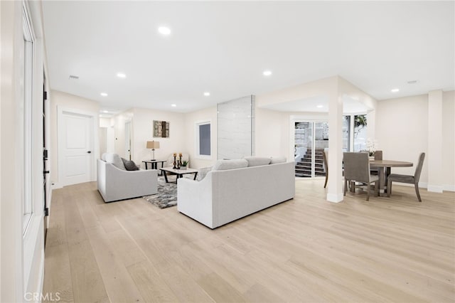 living room with light hardwood / wood-style floors