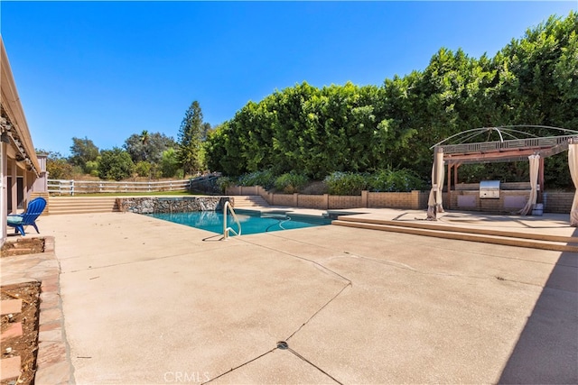 view of swimming pool featuring a patio