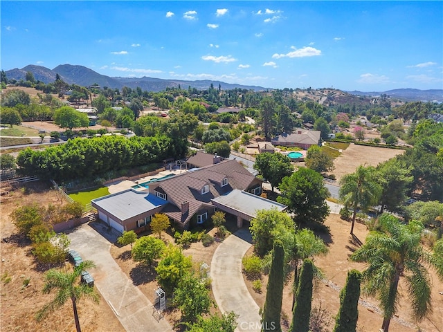 birds eye view of property featuring a mountain view