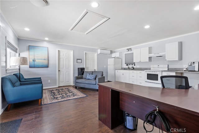 kitchen with white appliances, white cabinetry, range hood, dark hardwood / wood-style flooring, and an AC wall unit