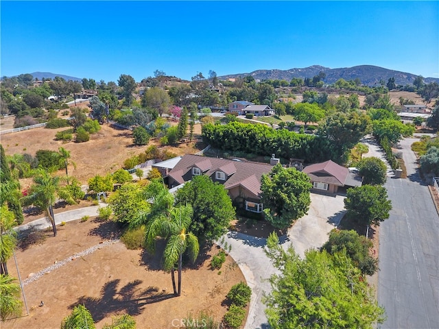 birds eye view of property featuring a mountain view