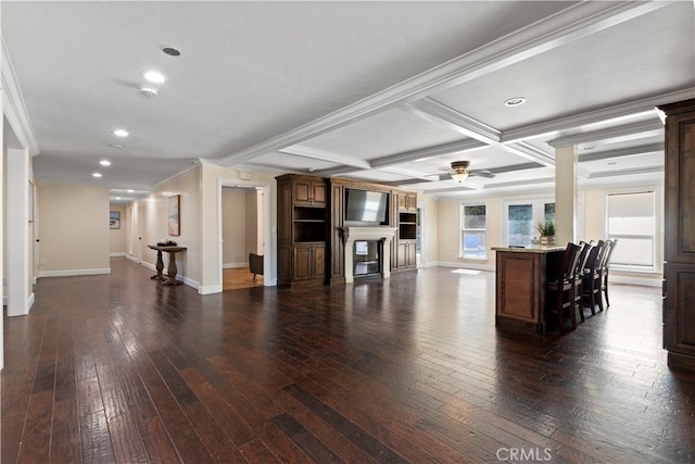 living room featuring ceiling fan, beamed ceiling, crown molding, and dark hardwood / wood-style flooring