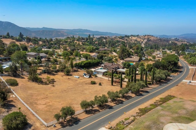 birds eye view of property with a mountain view