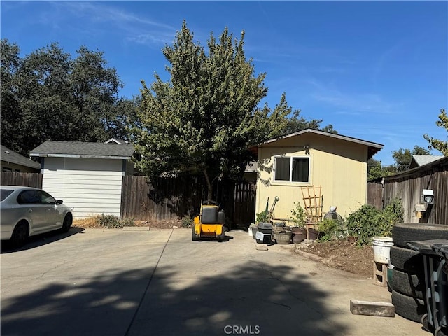 view of home's exterior featuring a patio area and an outdoor structure