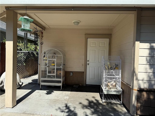 doorway to property featuring a patio area