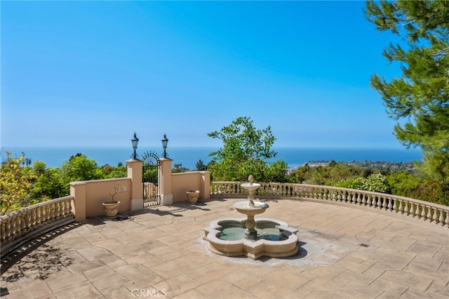 view of patio / terrace with a water view