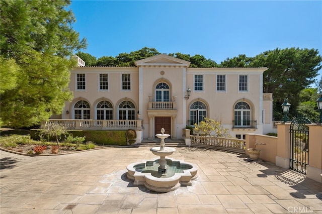 back of house featuring french doors