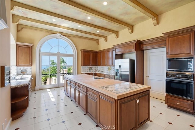 2736 Via Victoria, Palos Verdes Estates, CA 90274 - kitchen with a sink, light countertops, black appliances, and beam ceiling