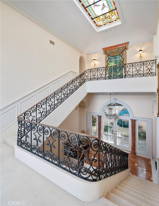 2736 Via Victoria, Palos Verdes Estates, CA 90274 - staircase featuring a towering ceiling, visible vents, a notable chandelier, and ornamental molding