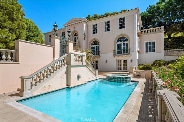 2736 Via Victoria, Palos Verdes Estates, CA 90274 - back of house featuring a pool with connected hot tub, stairway, stucco siding, french doors, and a patio area