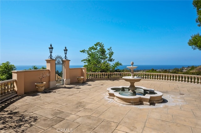 view of patio featuring a water view