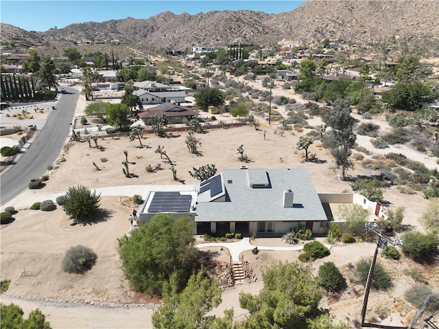 birds eye view of property featuring a mountain view