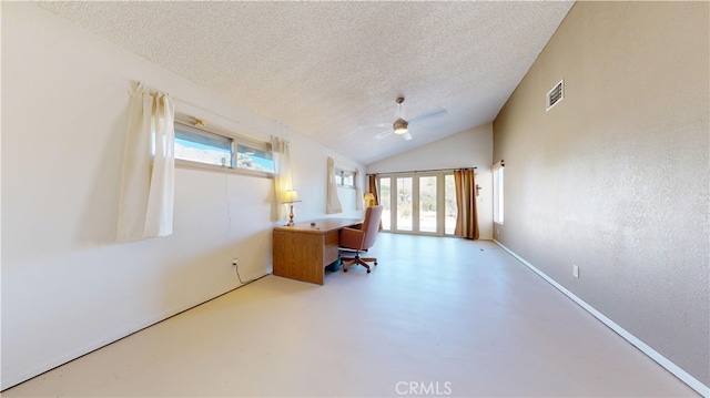 unfurnished office featuring ceiling fan, a textured ceiling, and vaulted ceiling