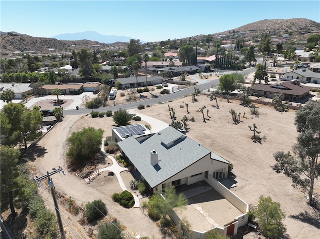 birds eye view of property featuring a mountain view