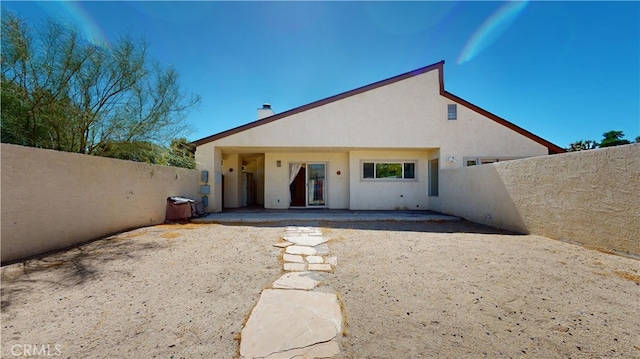 back of property featuring a patio