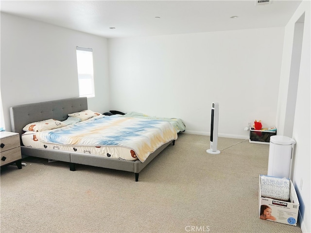 bedroom featuring carpet