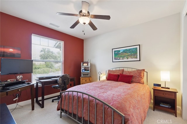 bedroom with light carpet and ceiling fan