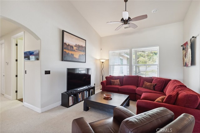 carpeted living room featuring lofted ceiling and ceiling fan