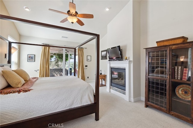 bedroom with light carpet, lofted ceiling, access to exterior, and ceiling fan