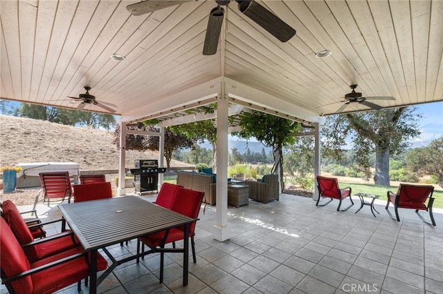 view of patio / terrace featuring an outdoor hangout area, ceiling fan, and grilling area