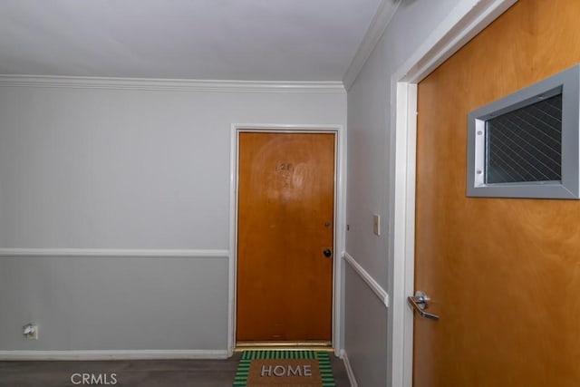 doorway featuring crown molding