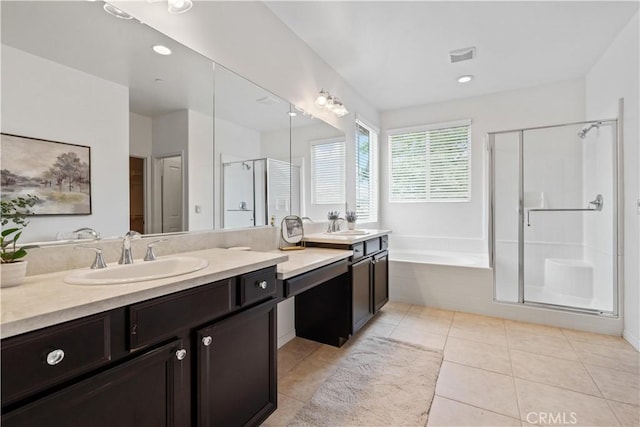 bathroom with tile patterned floors, vanity, and plus walk in shower