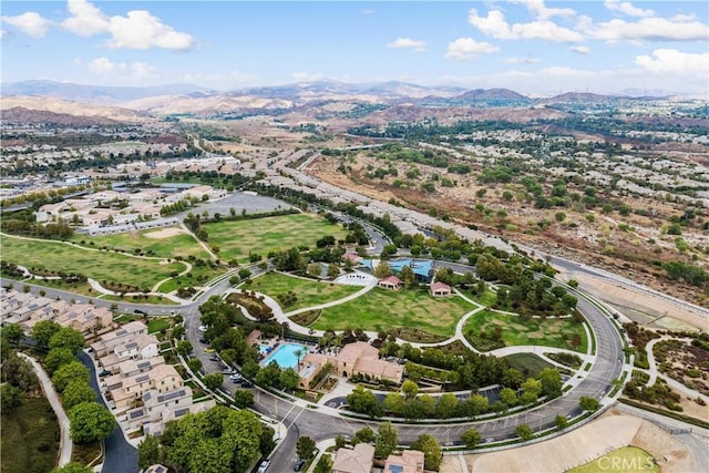 birds eye view of property with a mountain view