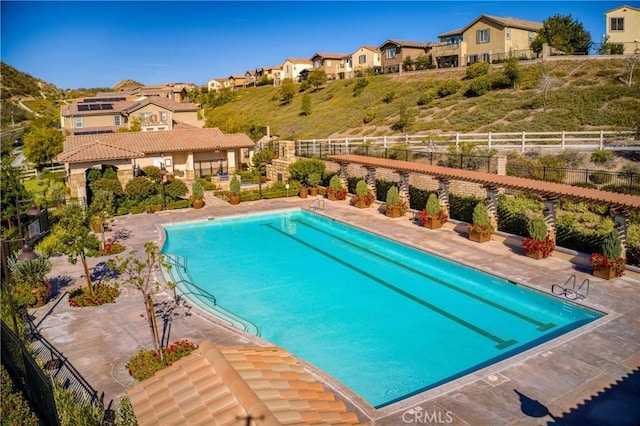 view of swimming pool featuring a patio area