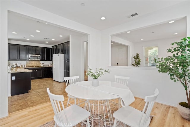 dining room featuring light wood-type flooring