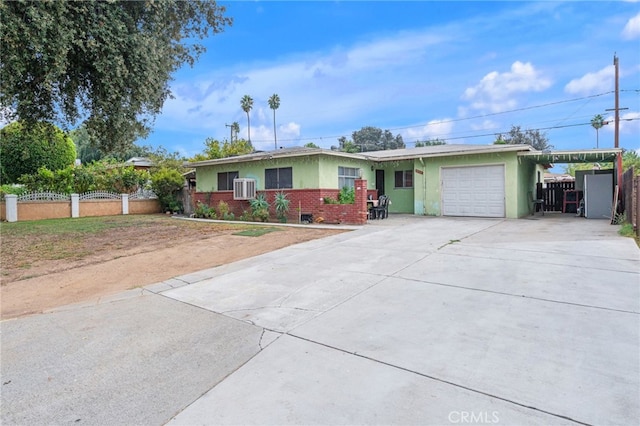 ranch-style house featuring a garage and a carport